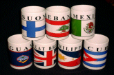 Seven mugs, from your smALL FLAGs store, posing as a group.
