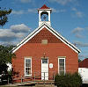 An archtypical Little Red Schoolhouse.